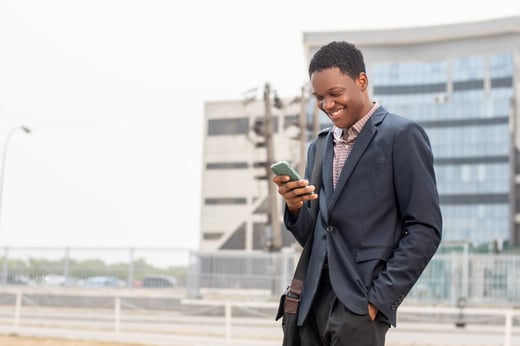 African man using phone