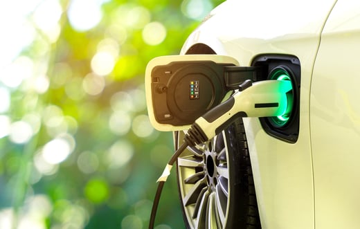 EV_Car_or_Electric_car_at_charging_station_with_the_power_cable_supply