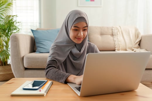Muslim woman using laptop