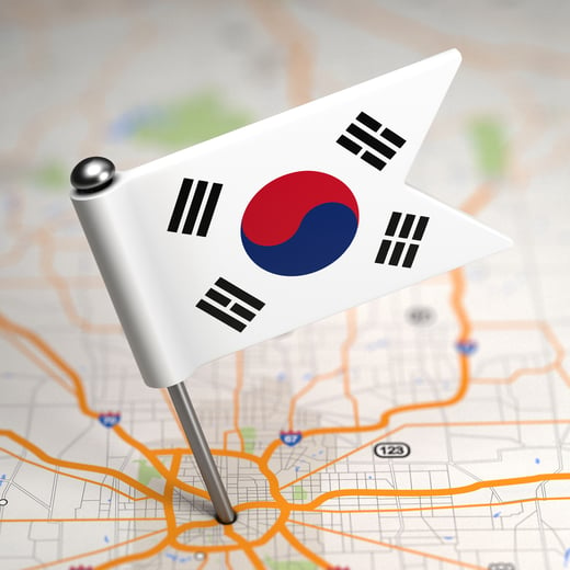 Small Flag of South Korea on a Map Background with Selective Focus.